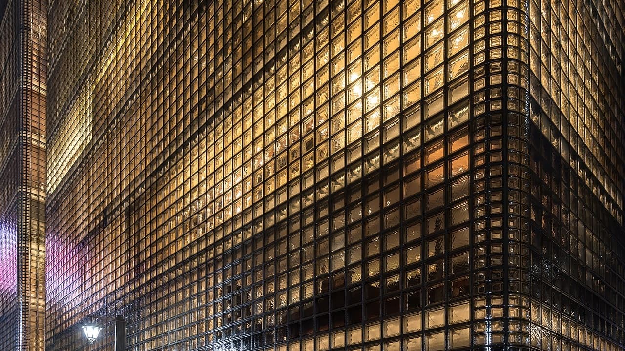 Maison Hermès Ginza façade — luxury architecture by night