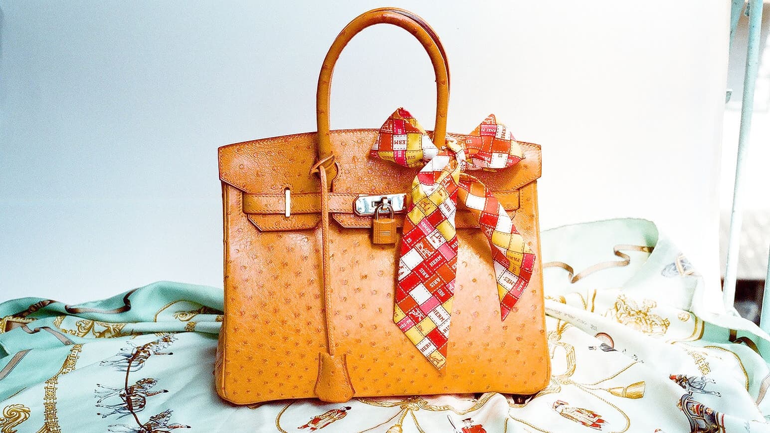 Hermès ostrich Birkin styled with a silk scarf