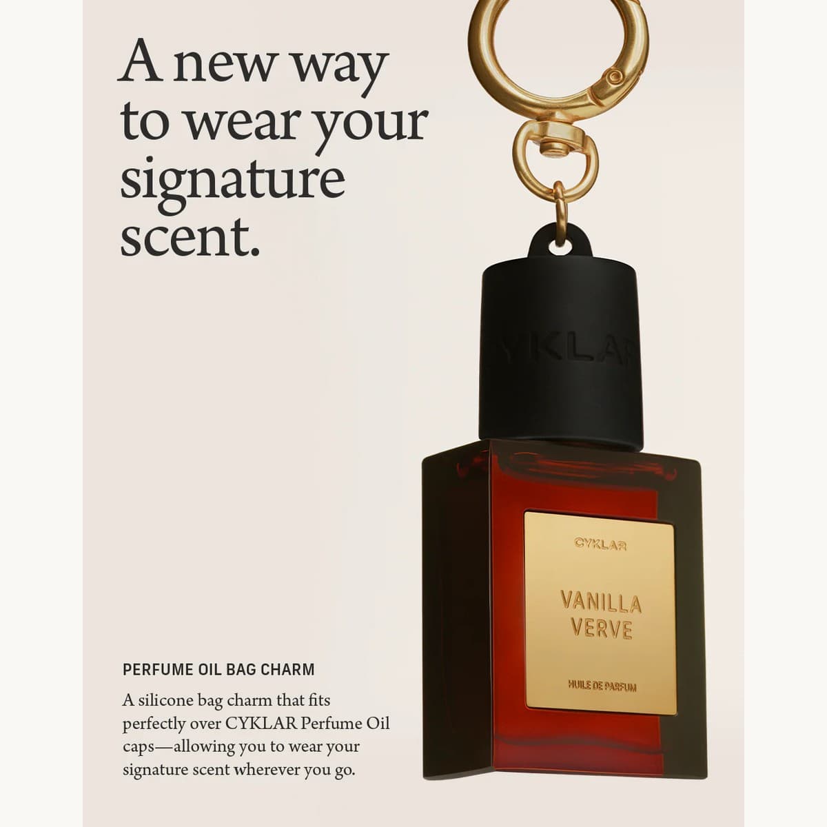 Cyklar perfume-oil charm hanging from a luxury bag